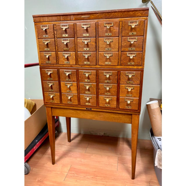 Gorgeous Library Bureau Sole Makers 30 drawer card catalog made with quarter sawn oak and brass drawer pulls. Sits on a...
