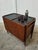 Elegant rosewood bar cart with a mid-century design. It is in excellent condition. Measurements: height 74cm, length 88cm,...