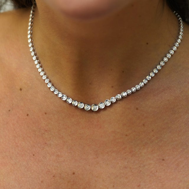Natural 3-carat graduated diamond tennis necklace in platinum 850 featuring thick bezel settings from 6mm to 3.5mm with...