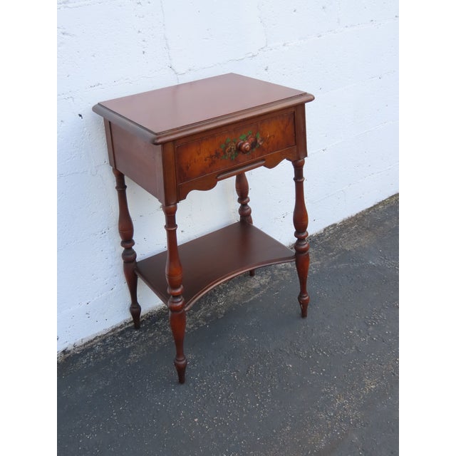 This delightful Nightstand Side End Table is made of wood, solid wood, and veneer. It was made by Berkey and Gay Furniture...