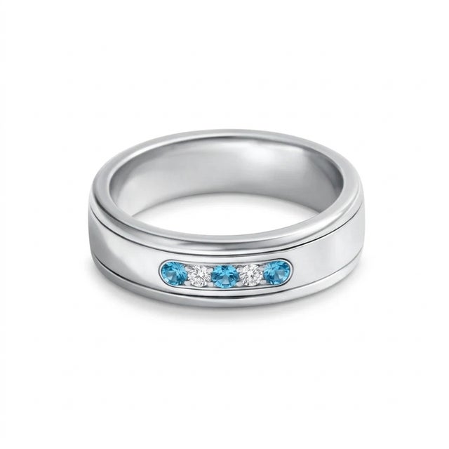This modern and sophisticated ring features a sleek band design accented with a striking combination of Blue Topaz and...