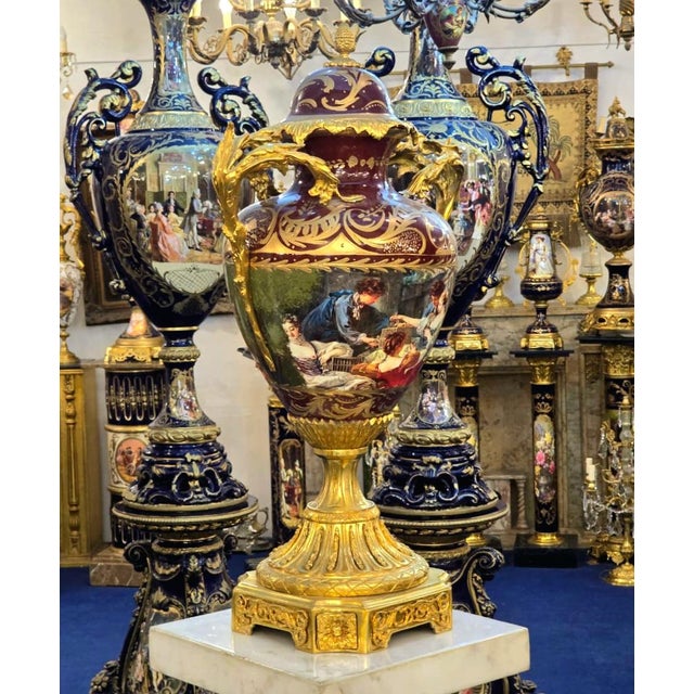 Add an unmistakable sense of European grandeur to your interior with this ornate French-style porcelain vase, featuring a...