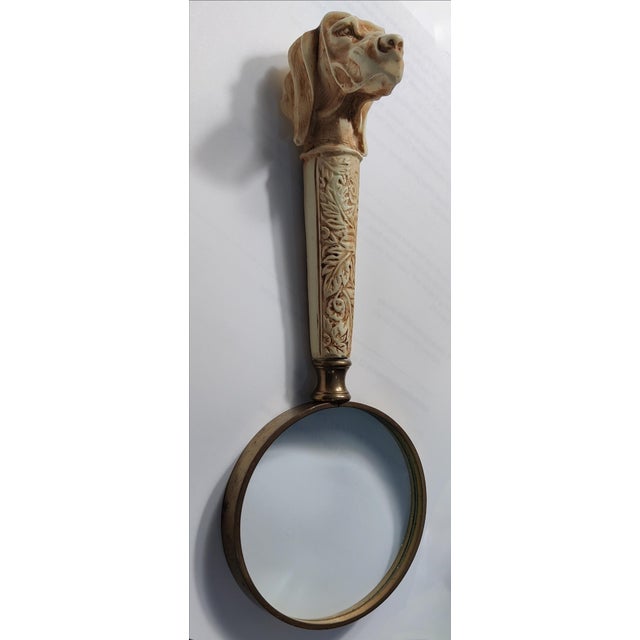 For your consideration. . . A figural vintage dog head magnifying glass. The magnifying glass features a long faux ivory...