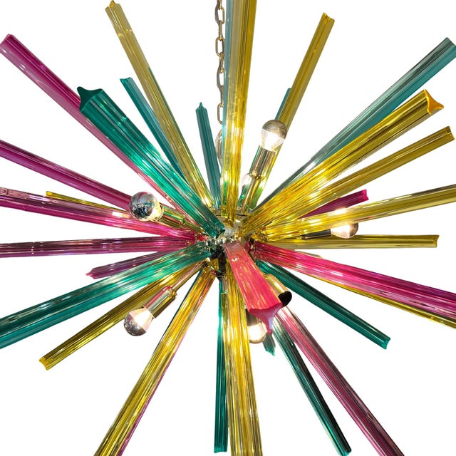 Striking multicolored ceiling lamp with individual Murano glass bars and a trihedral profile. It combines fuchsia pink,...