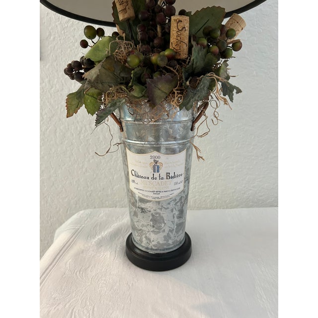 Charming, unique, artisanal table lamp in a vineyard motif. Original wiring in working condition. Holds one 60 watt bulb....