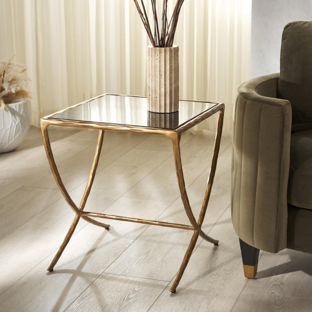 Invite a touch of glam and sophistication with our Debbie accent table. Our sleek and minimal accent table features a...