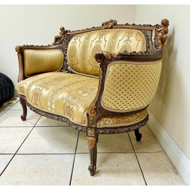Fall in love with this stunning French Rococo-style sofa, fully refinished with luxurious gold leaf and plush padding. The...