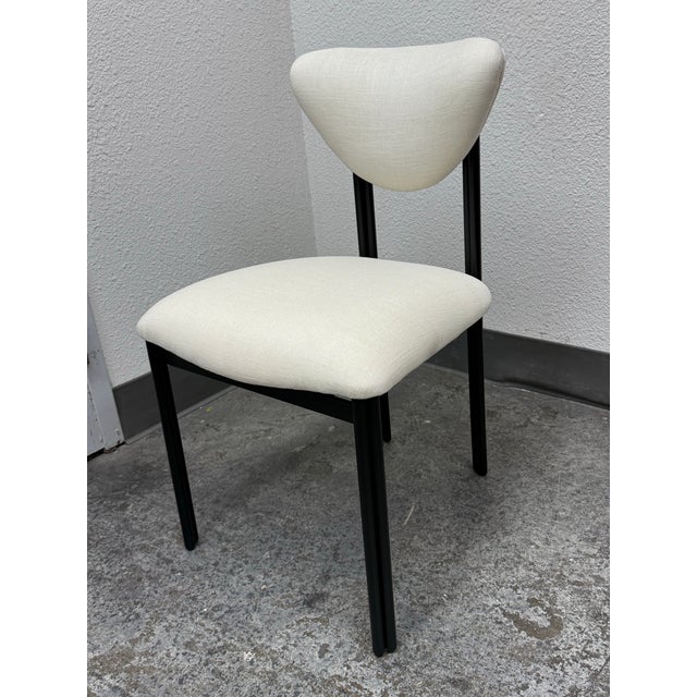 Design Plus Gallery presents the Cooper Dining Chair. Drawing inspiration from mid-20th-century organic modernism, the...