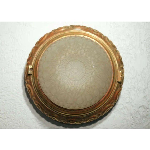 An original 1940s bronze dome ceiling or wall light fixture or sconce complete with original frosted shade. US standard...