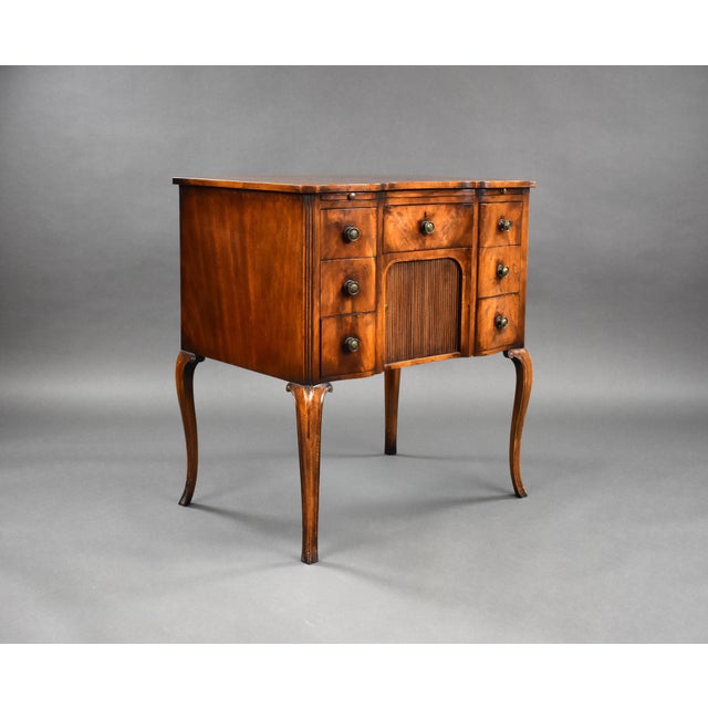 A good quality 19th century yew wood chest, serpentine in form, having a writing slide to the top over an arrangement of...