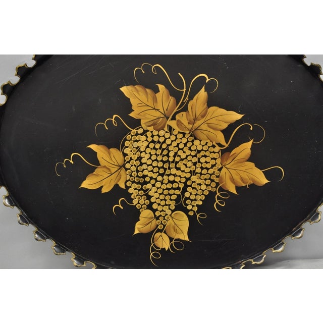 Vintage French Country Black and Gold Hand Painted Oval Toleware Tole Metal Serving Tray. Circa Mid 20th Century....