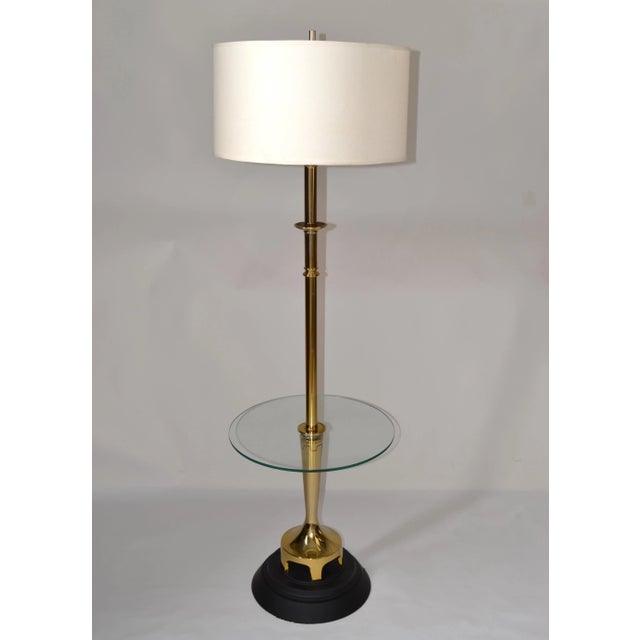 Vintage brass round glass side table floor lamp with drum shade made by Laurel Lamp Company. Features a unique...