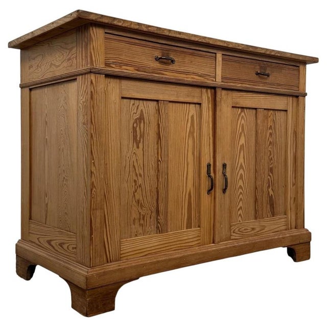A handsome early 20th-century English Edwardian cupboard, finely crafted from pitch pine and distinguished by its...