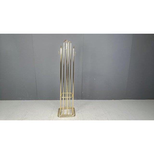 Large brass modernist coat stand with space for umbrella storage. Beautiful Shiny brass. 1970s - Belgium Very good...