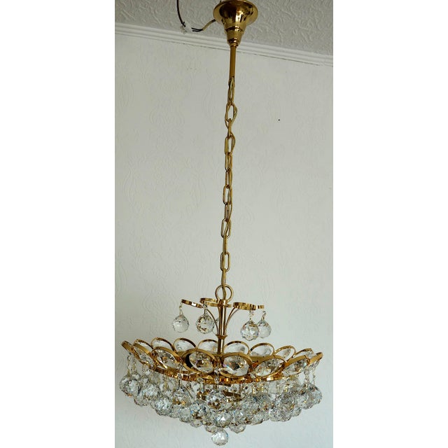 Brass and Rainbow Lead Crystal 8-Light Chandelier from Palwa, 1960s, in Very Good conditions. Designed 1960 to 1969 I have...