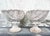 Vintage pair of cast stone nautilus shell planters. Large shells on coral branch bases.