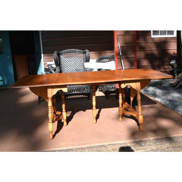 This is a very versatile table by Watertown, WI. I believe it is maple wood due to the color/weight. Butterfly ends &...