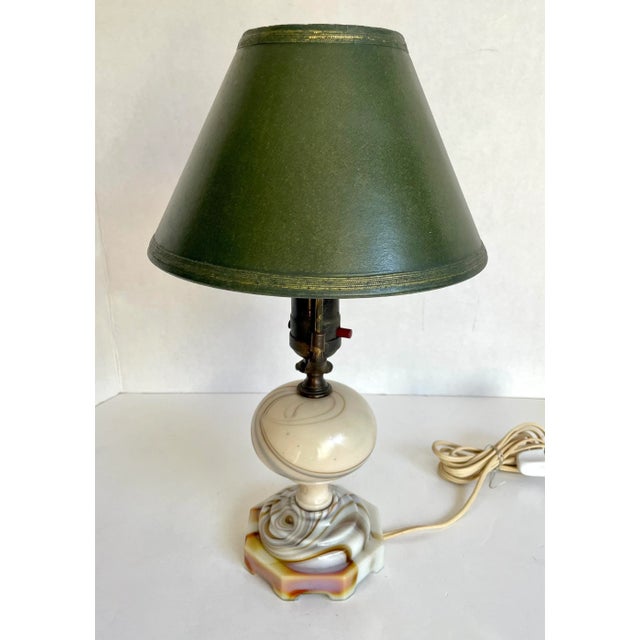 Here is a wonderful. petite/task lamp from the early 20th c., likely the 1920-30's. The base of the lamp is made from art...