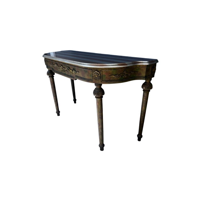 This vintage French Louis XVI style demilune console table is a stunning piece of antique furniture that exudes elegance...