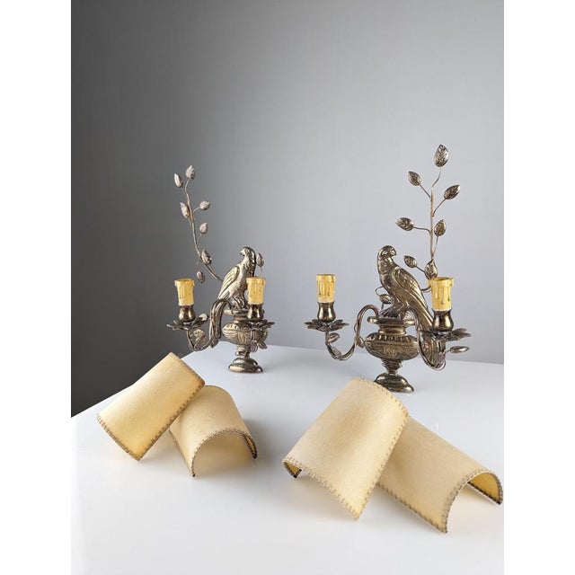 Beautiful pair of wall lamps with the exquisite parrots design between vegetation of the prestigious Maison Baguès. These...