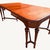 Handsome circa 1920s American Federal / Hepplewhite Revival dining table with elegant Neoclassical proportions and a rich...
