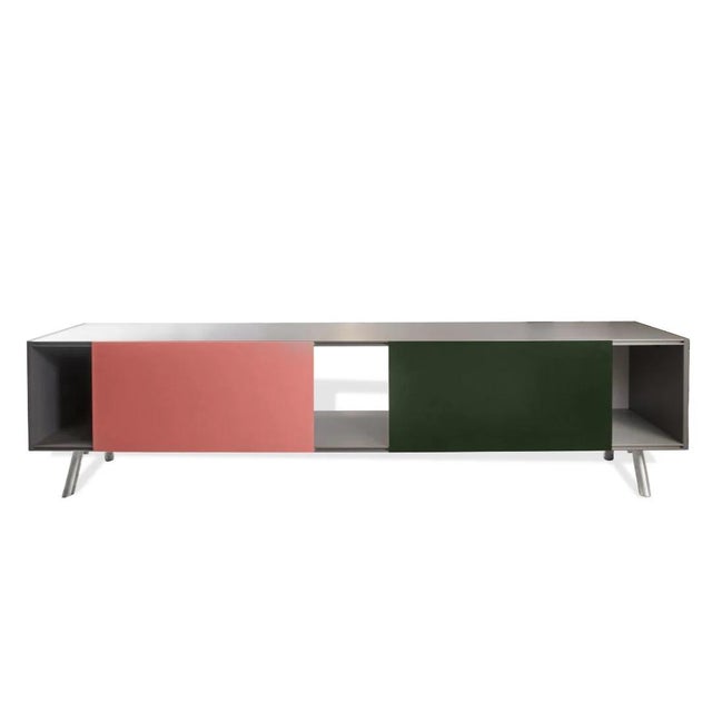 The Kast Cabinet, designed by Maarten Van Severen for Vitra, is a striking example of minimalist contemporary design...