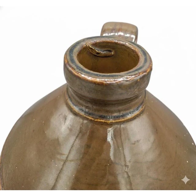 A fine antique one-gallon salt-glazed stoneware jug by E. Swasey & Co., Portland, Maine, circa 1890. This handsome two-...