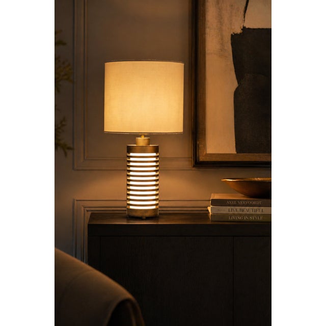 Pollux is a metal table lamp made in Italy, designed around the balance between material structure and light diffusion....