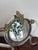 Rare Murano glass table mirror, 1949 The circular mirror is crowned by an ornate metal finial (patinated bronze) featuring...