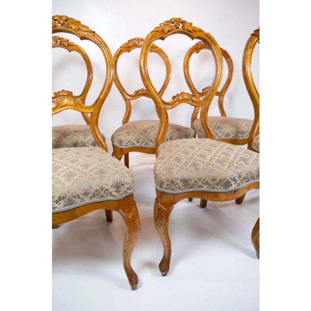 Set of six Rococo dining room chairs of light mahogany and fabric with pattern from circa 1760s. The chairs are in great...