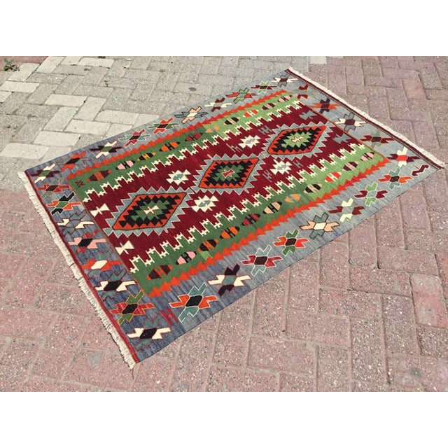 This beautiful, vintage, handwoven kilim is approximately 60 years old. It is handmade of very fine quality, hand-spun...