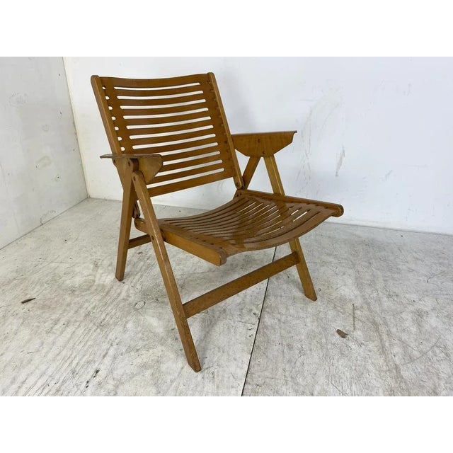The “Rex” folding chair is a design by Niko Kralj, manufactured by Stol Kamnik in Slovenia around 1960. Made of high...