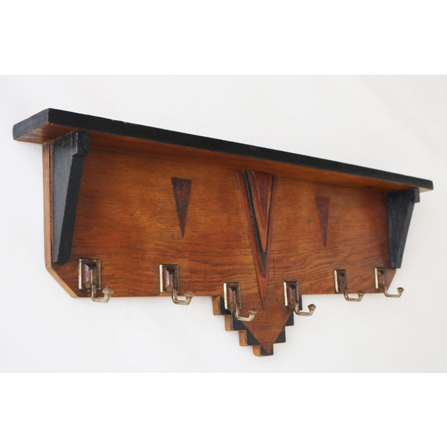 A striking Dutch art deco coat rack in ''Amsterdam school'' design style. Made from solid european oak with ebonized...