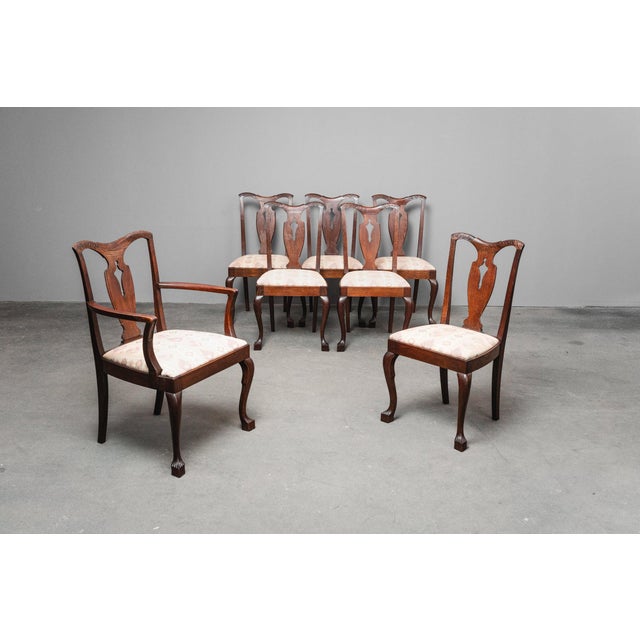 Item: Set of 7 chairs (one of which is an armchair) Period & Style: Art Nouveau - Early 20th Century Features: - Elegant...