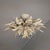 Large lacquered iron ceiling light from the 1970s. Made in Italy in the Fornasetti style. Floral structure with 9 lights....