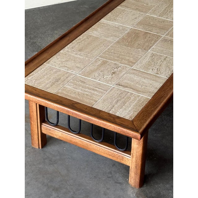 Monumental travertine and walnut coffee table with iron detailing. Very well made and solid. Minimal wear from age. 65.5”L...
