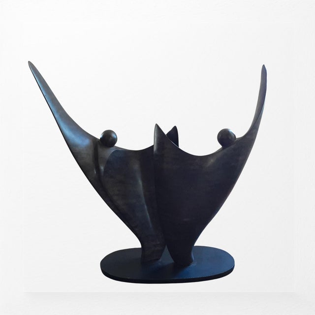 A dynamic bronze sculpture by American sculptor Robert Holmes, titled "Flower Dancer," cast in 1988 and signed and...