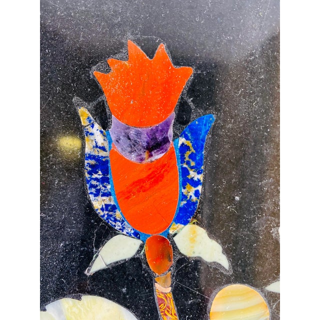 Pair of pietra dura black marble panels with colorful marble inlay decoration of flowers/