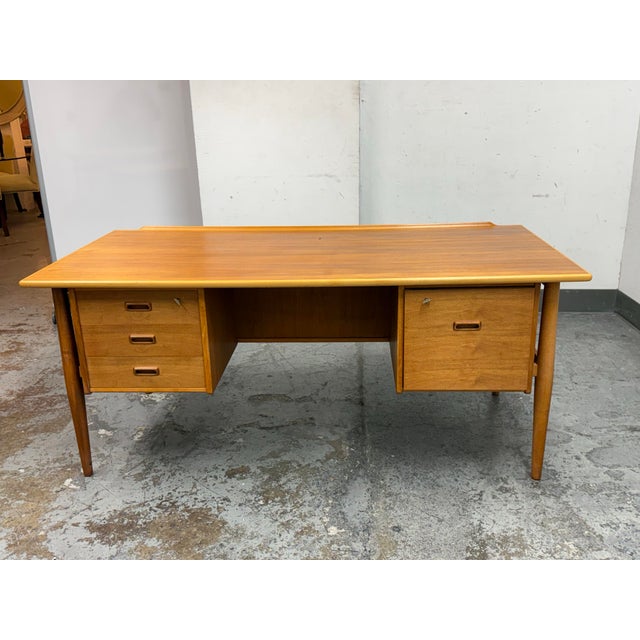 Design Plus Gallery presents a Teak Wood Desk from the Mid 20th Century and Danish Design. A true relic of an era that...