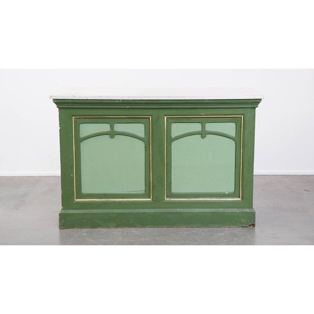 We are offering this unique antique green counter/sideboard/side table from the late 19th/early 20th century with a marble...