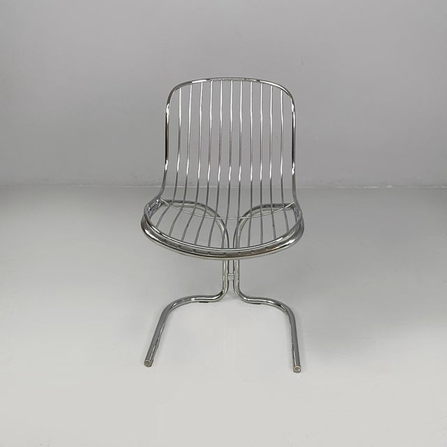 Italian modern chairs in steel, 1970s Set of six steel chairs. The seat and backrest are made of curved metal rods. The...