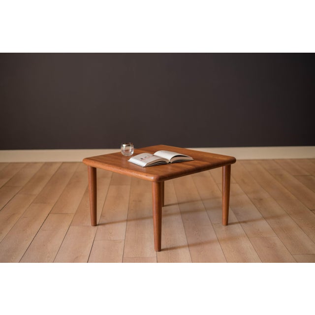 Mid century modern square coffee table manufactured by Glostrup Møbelfabrik, circa 1970's. Features a solid planked teak...