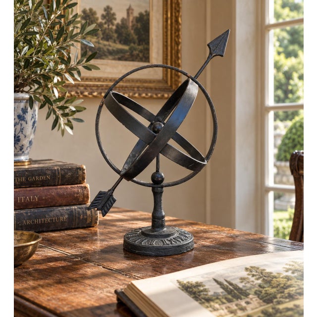 A beautifully crafted iron armillary sphere, evoking the timeless elegance of classical European gardens. Pieces like this...