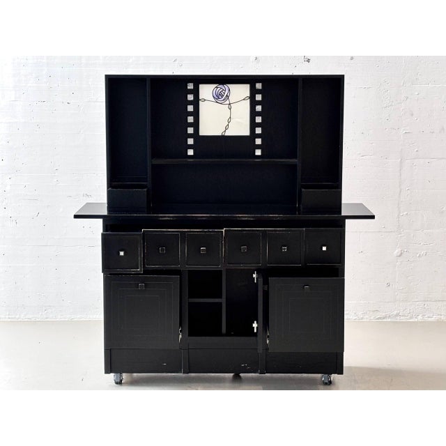This exceptional sideboard, designed by charles rennie mackintosh, combines architectural clarity with the distinctive...
