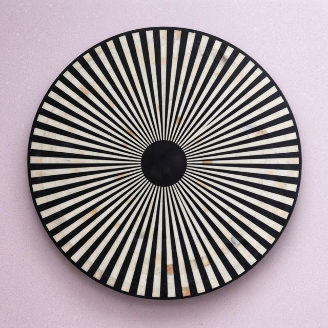 The Nova & Raya Dining Set brings together intricate Mother of Pearl inlay, natural cane, and sculptural form in a...