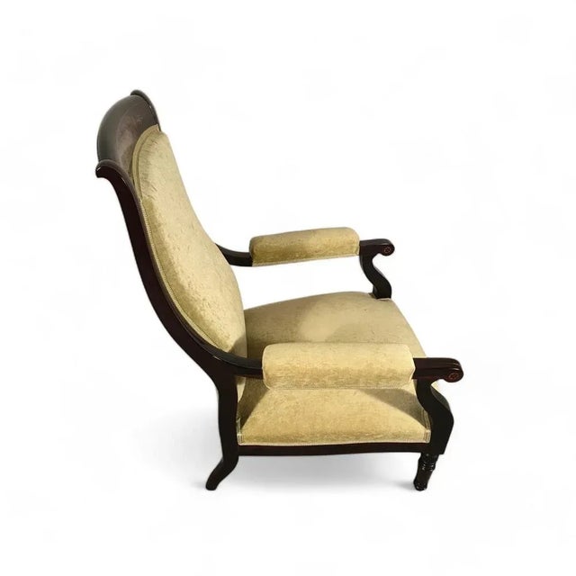 This low armchair dates back to around 1840 and comes from France. The chair was made during the French Restoration...