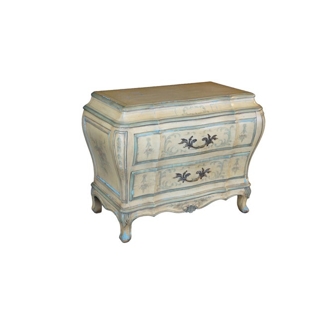 This mid-century Karges Venetian-style bombe chest is a masterclass in French Provincial cabinetry, showcasing a heavily...