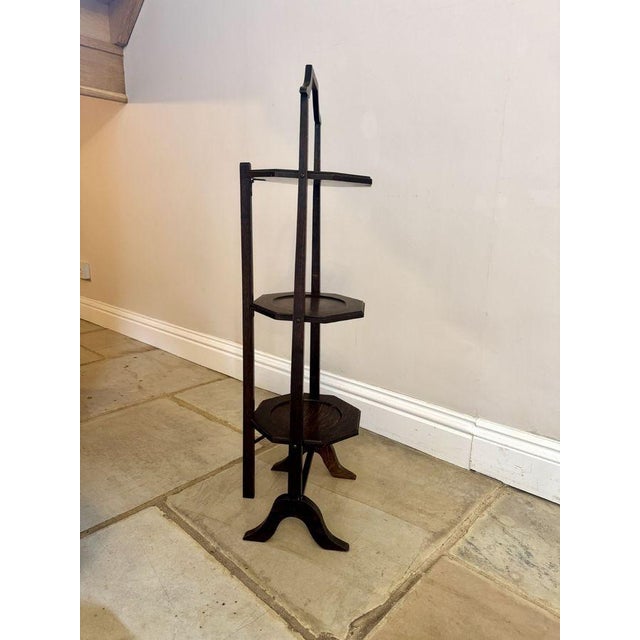 Antique Edwardian quality oak folding cake stand, having three oak folding plate stands an oak carrying handle to the top...