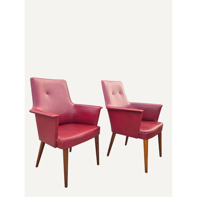 Elegant pair of Italian armchairs produced by Anonima Castelli in the second half of the 1950s. The design perfectly...