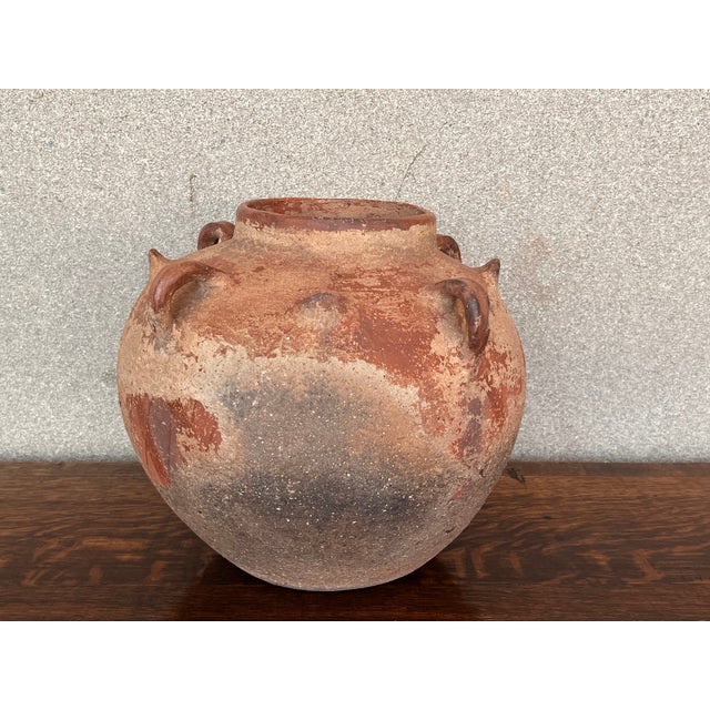 Old tinaja of Calanda (Teruel), Spain. Made of red clay with handcrafted circular figures and four handles. A "tinaja" is...